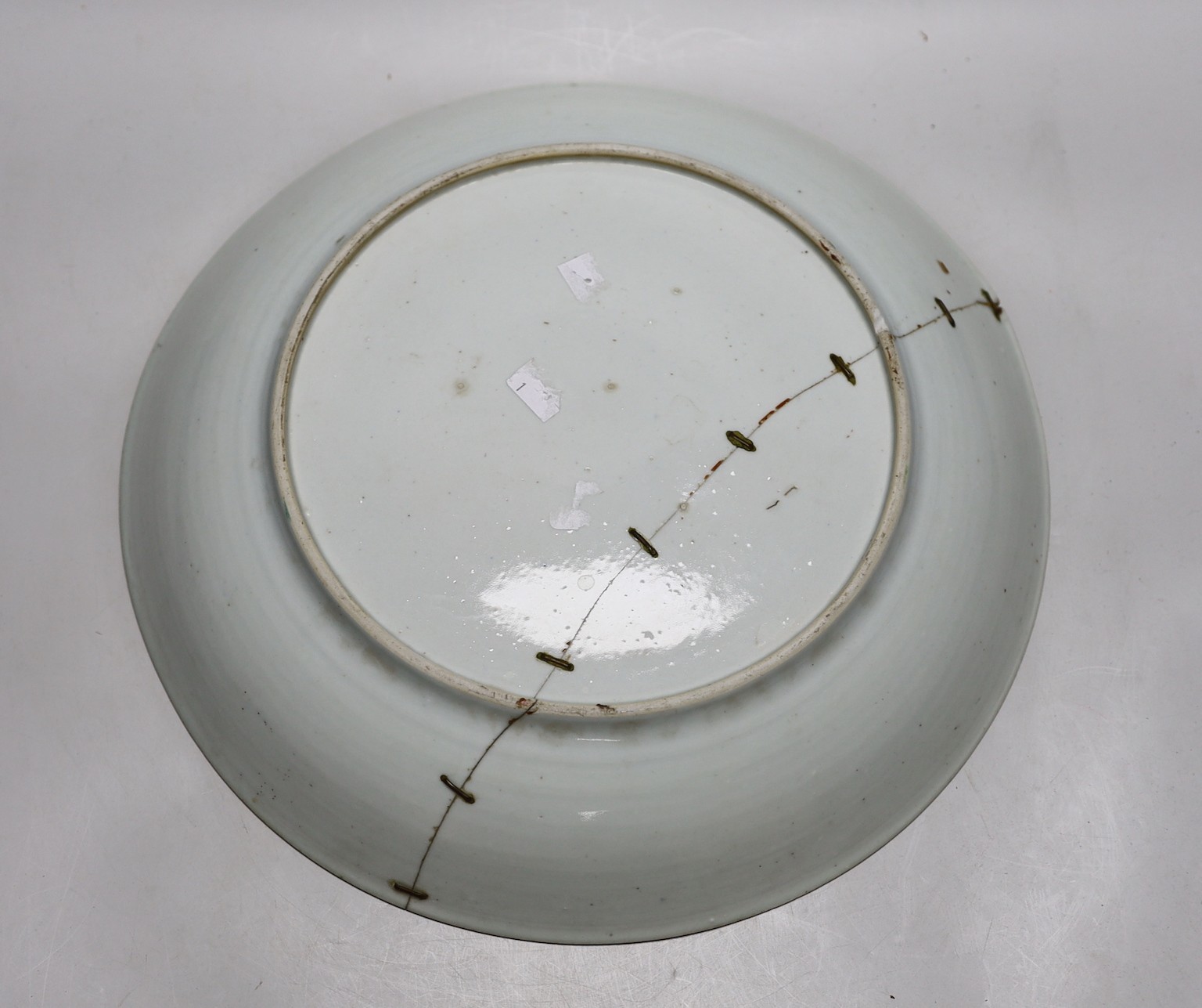 An 18th century Chinese famille rose charger and a Canton plate, charger 36cms